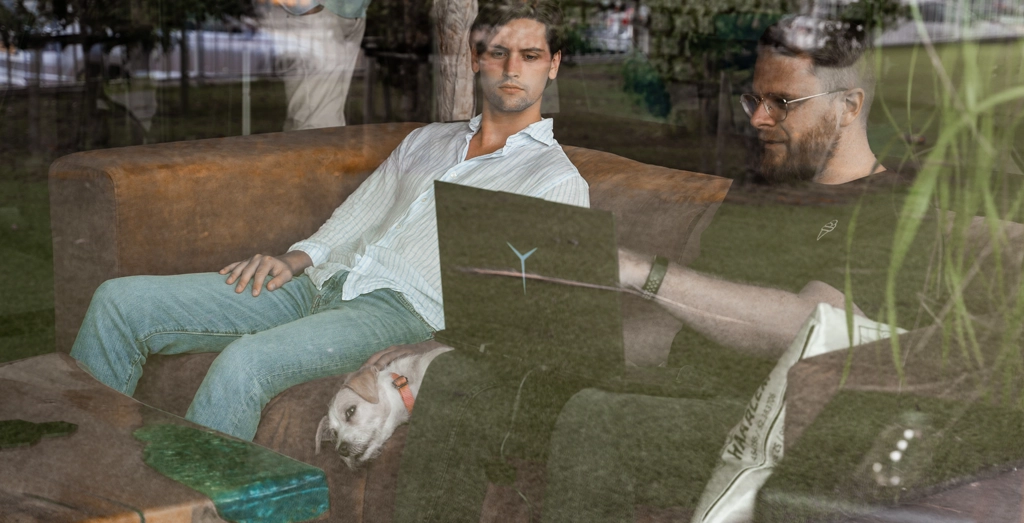 MIBTL Media Employees looking at laptop